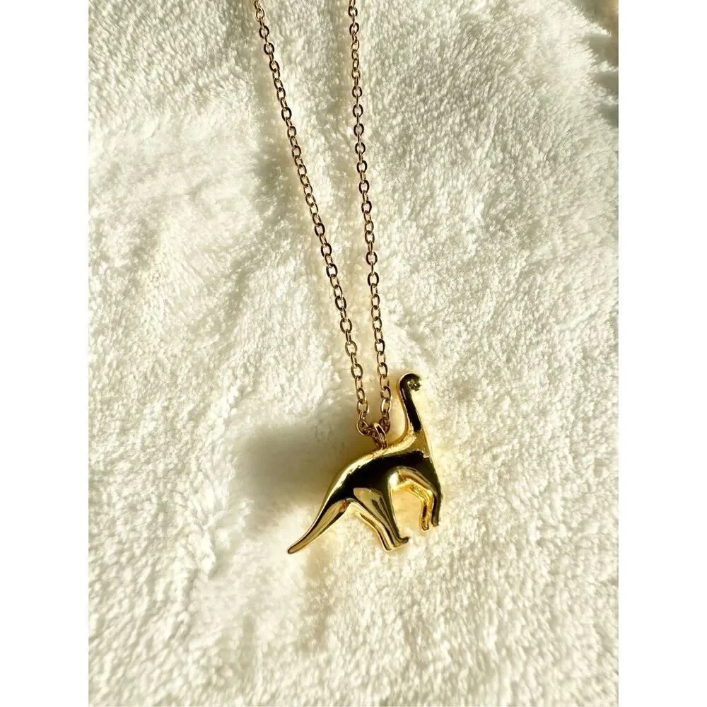 Gold color brachiosaurus pendant necklace